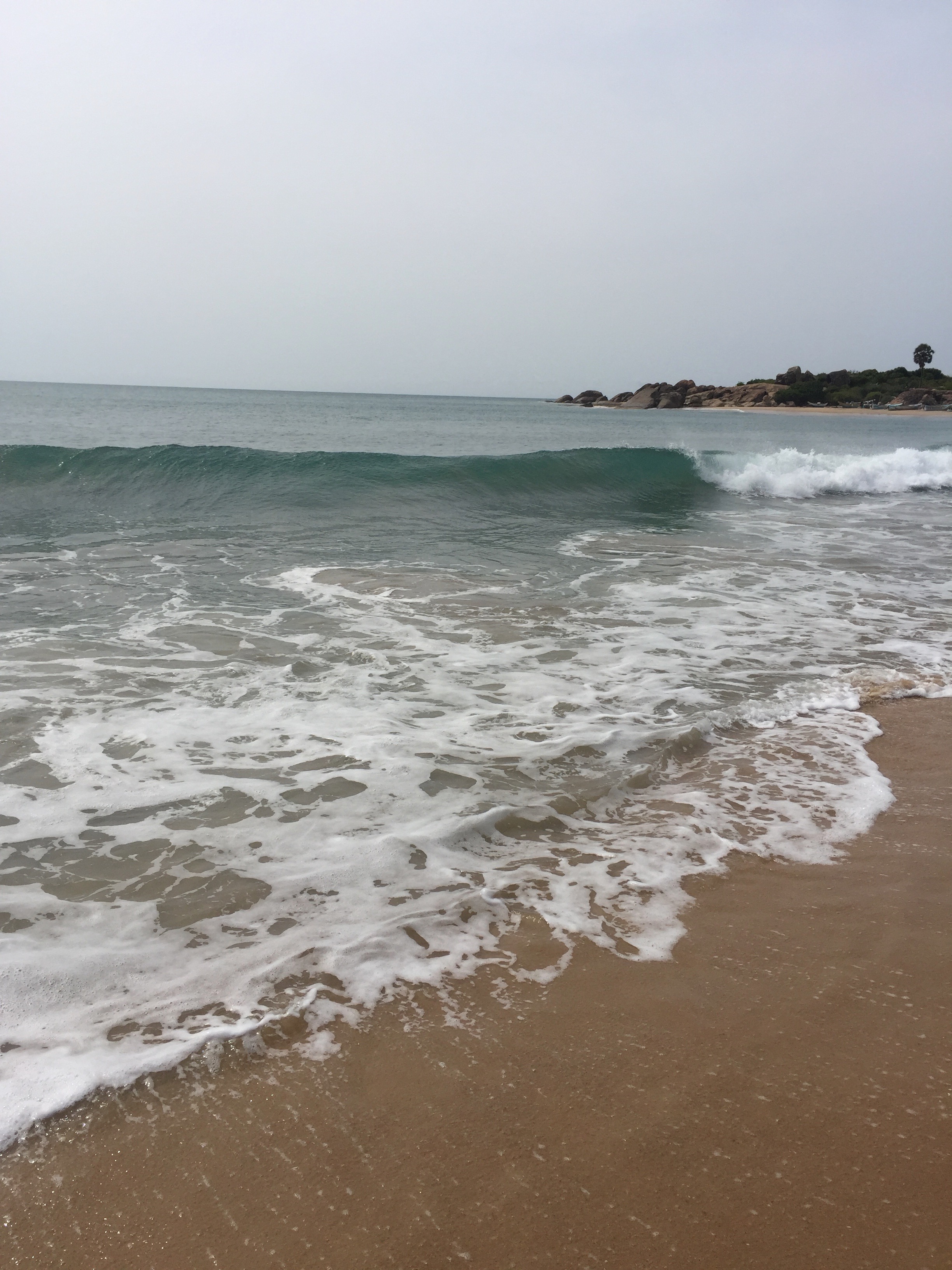 Whiskey Point Arugam Bay with calm turquoise water and golden sand beach