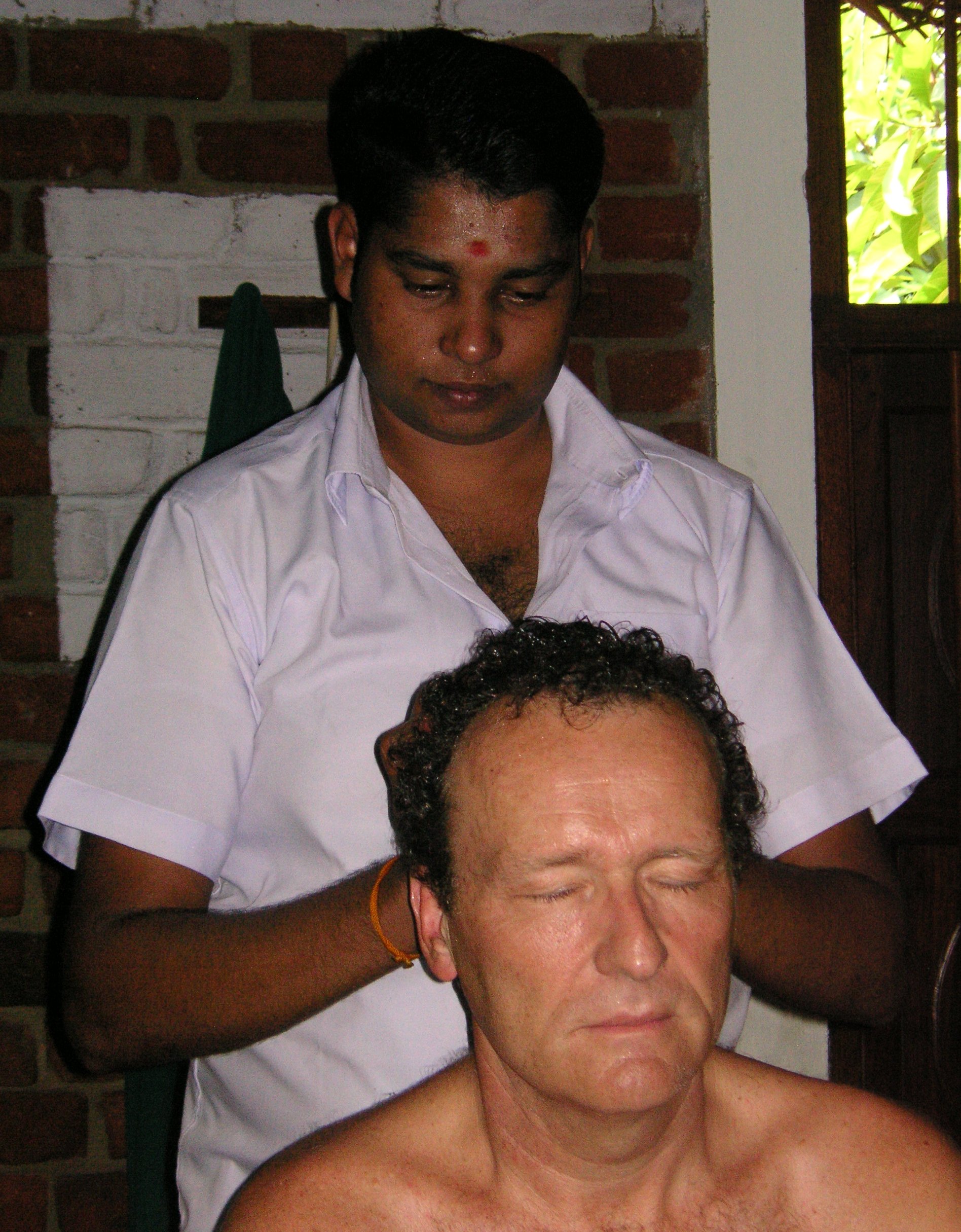 An Ayurvedic oil massage treatment in progress &mdash; the hands-on therapies that define a real Sri Lankan Ayurveda programme