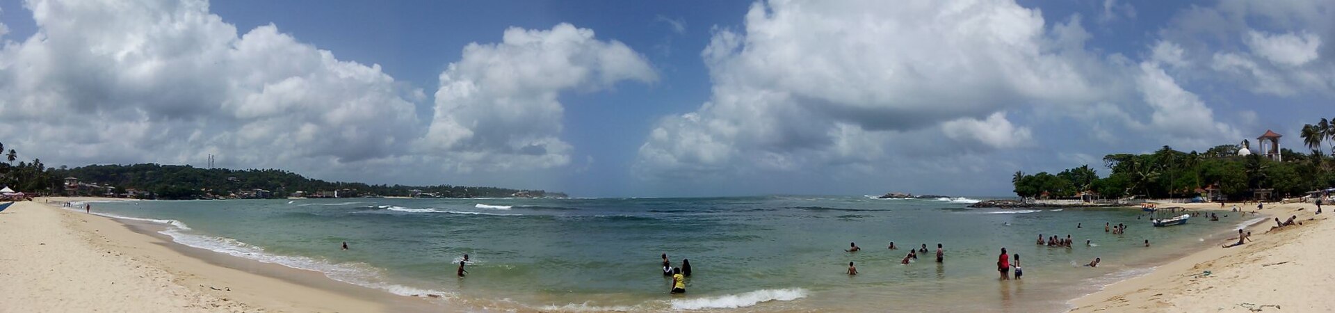 A calm palm-fringed Sri Lankan beach — the easiest and most rewarding setting for a family holiday with a baby or toddler