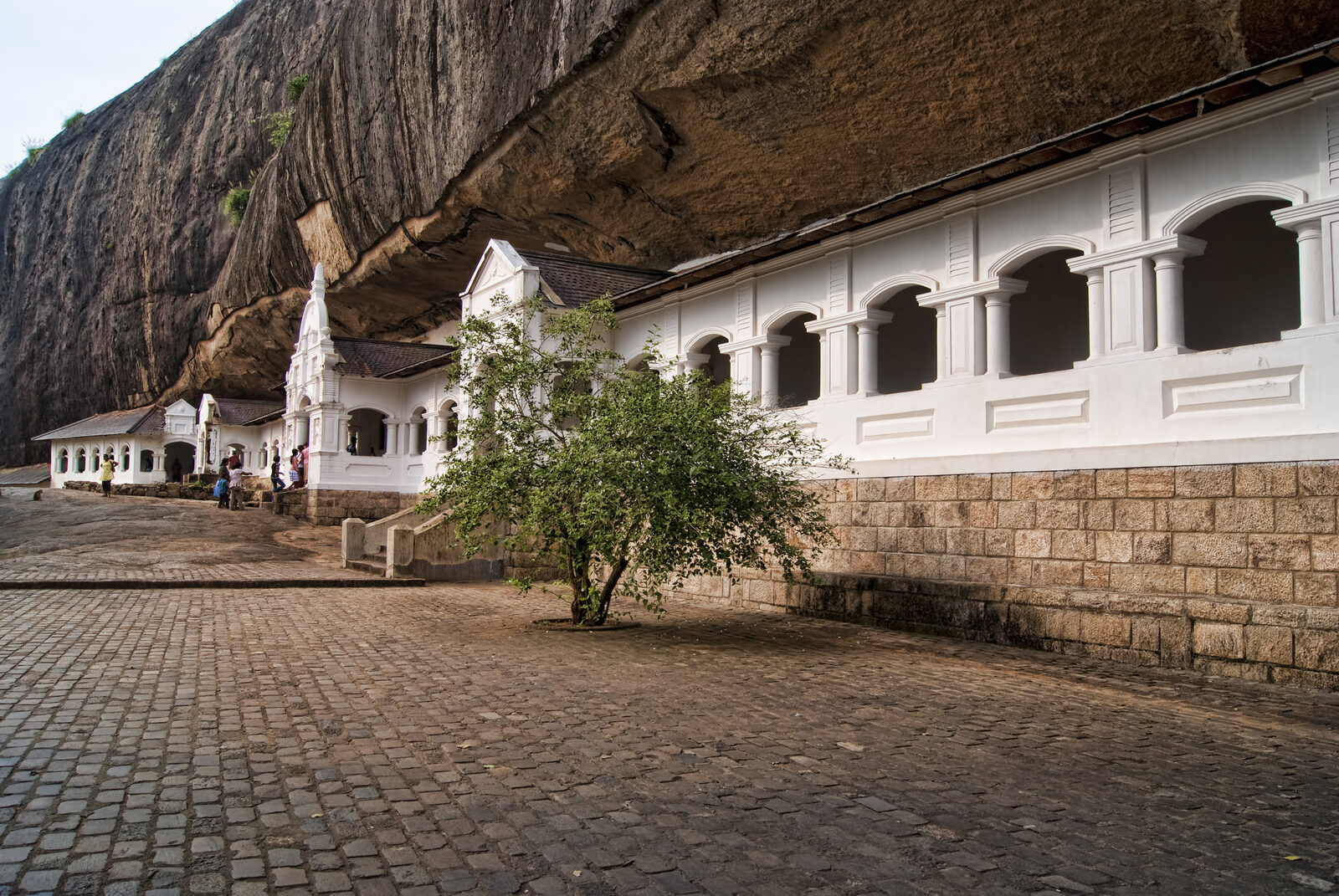 The painted cave shrines of Dambulla, where the barefoot walk and covered dress code apply from the entrance