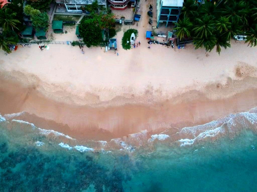 The beach at Hikkaduwa on Sri Lanka's south coast, where the coral sanctuary lies just metres from shore