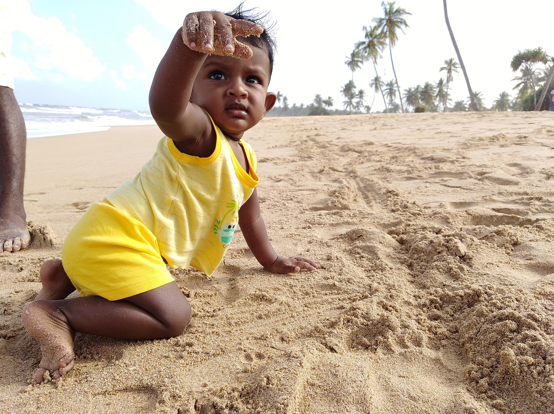 Nilaveli beach on Sri Lanka's east coast — white sand and calm August seas at the end of the solo loop