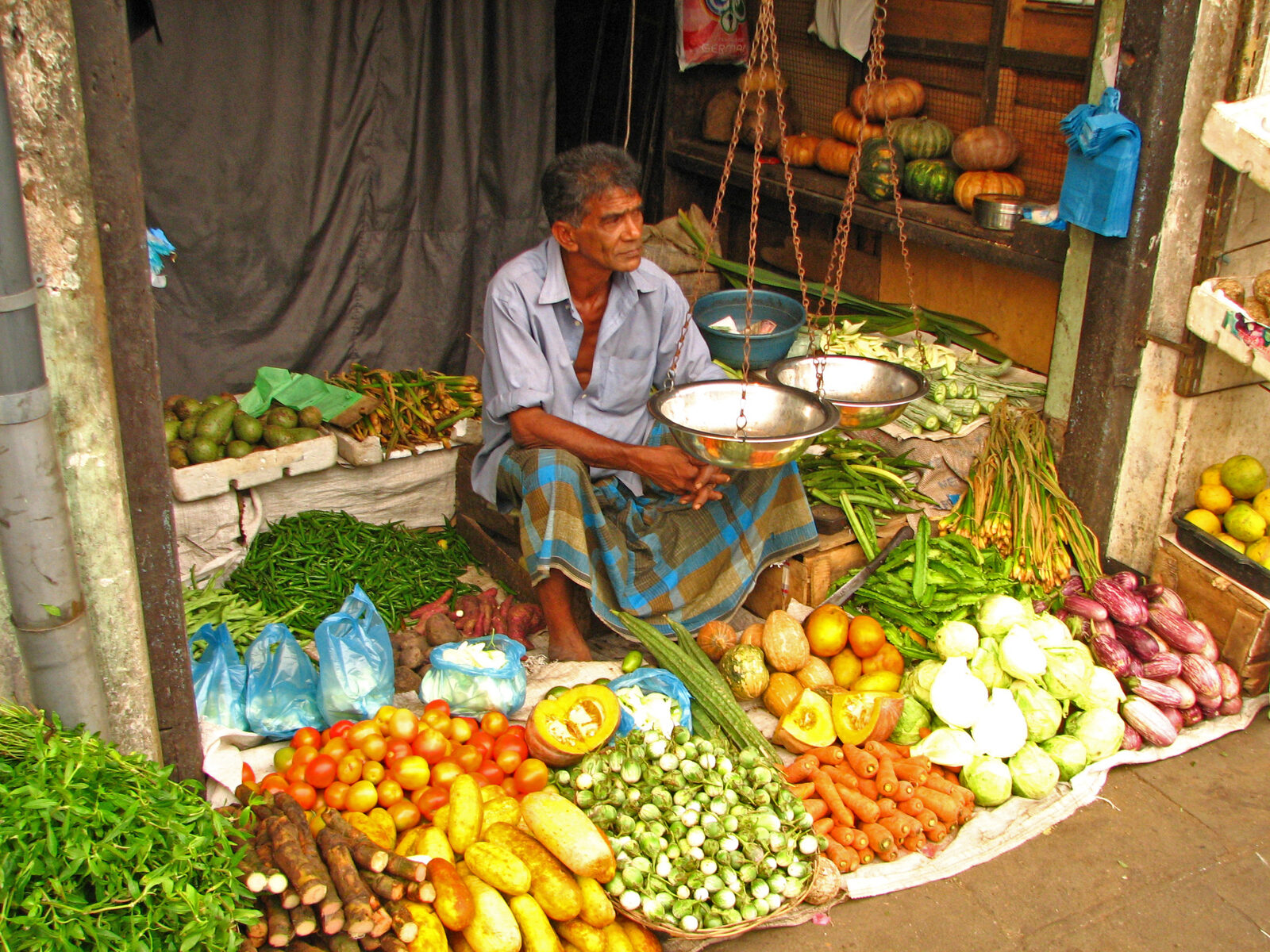 A colourful vegetable shop in Kandy — fresh produce and everyday supplies are cheap and easy to buy locally