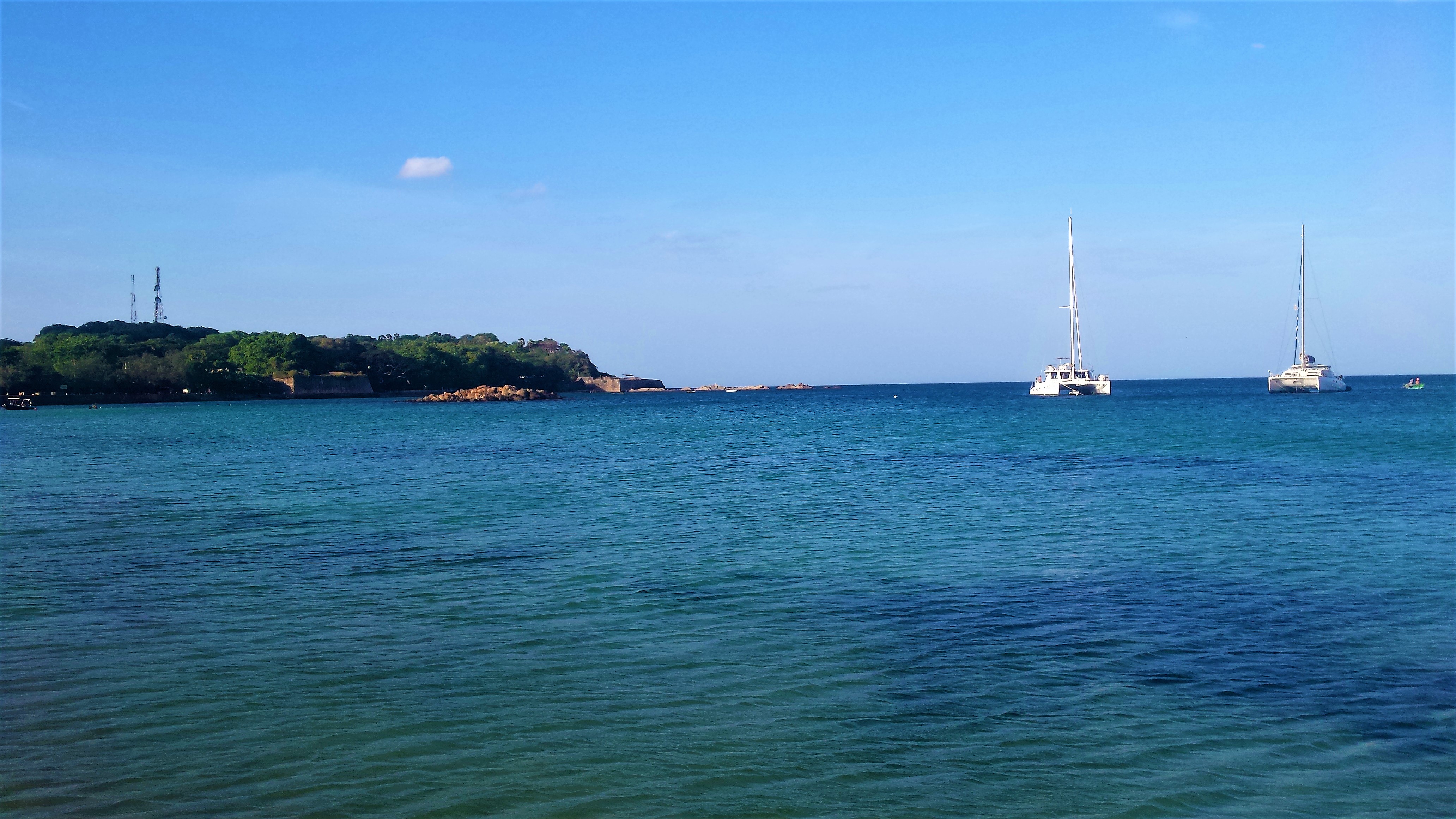 Tropical beach in Trincomalee with palm trees and turquoise water, Sri Lanka