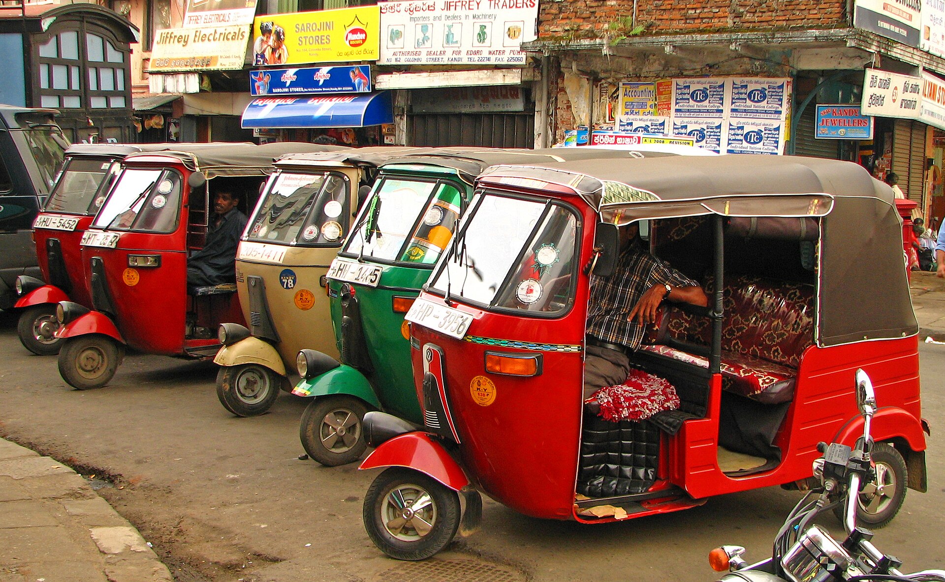 Tuk-tuks waiting for fares in Kandy, Sri Lanka - the ranks where inflated first quotes often start