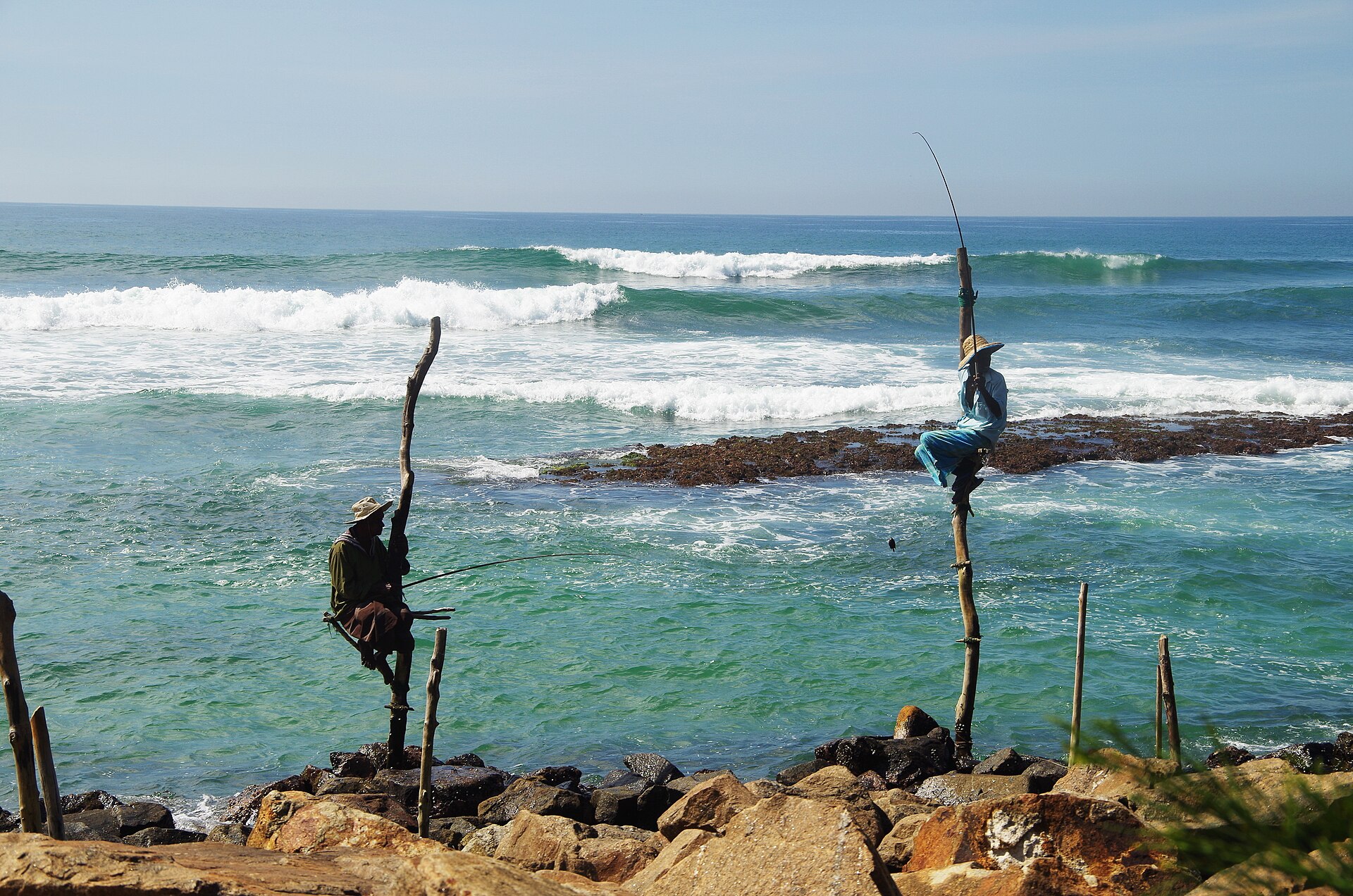 Stilt fishermen on Weligama beach, Sri Lanka